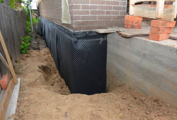Happy homeowners after waterproofing job in Reelsville